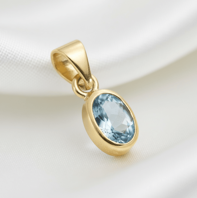 Anhänger Gelbgold mit Blautopas (beh.) 333 - Avrum